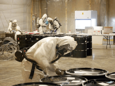 professionals checking containers for possible chemical biological or other nasty weapons